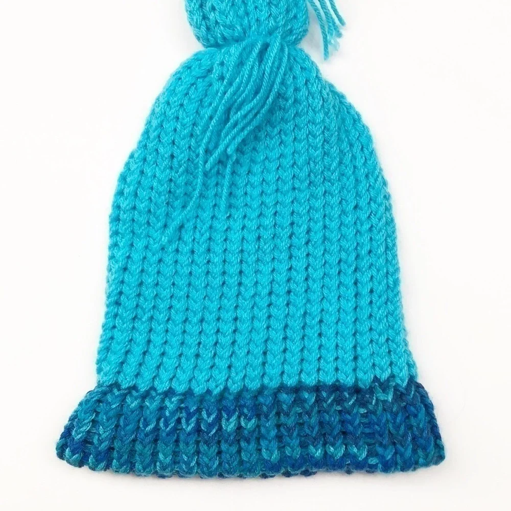 Blue pom pom crochet beanie